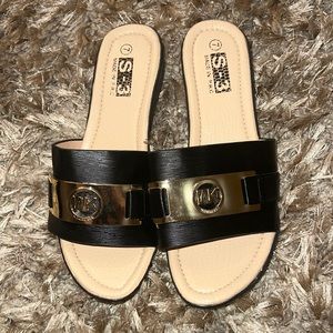 Beautiful Woman Sandals, Summer, Casual Black  with plastic Gold WK design.